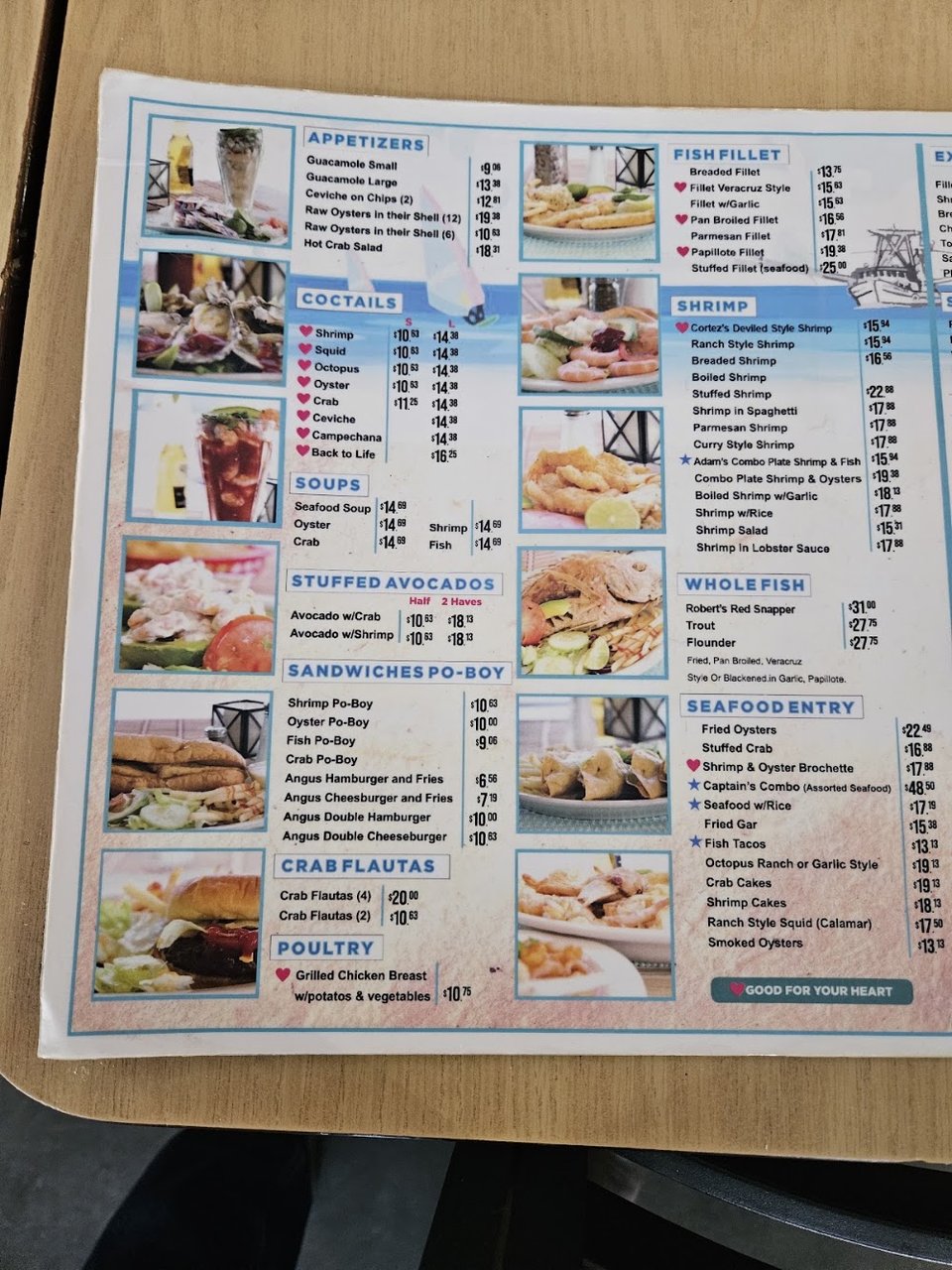 Seafood dishes listed on a menu board.